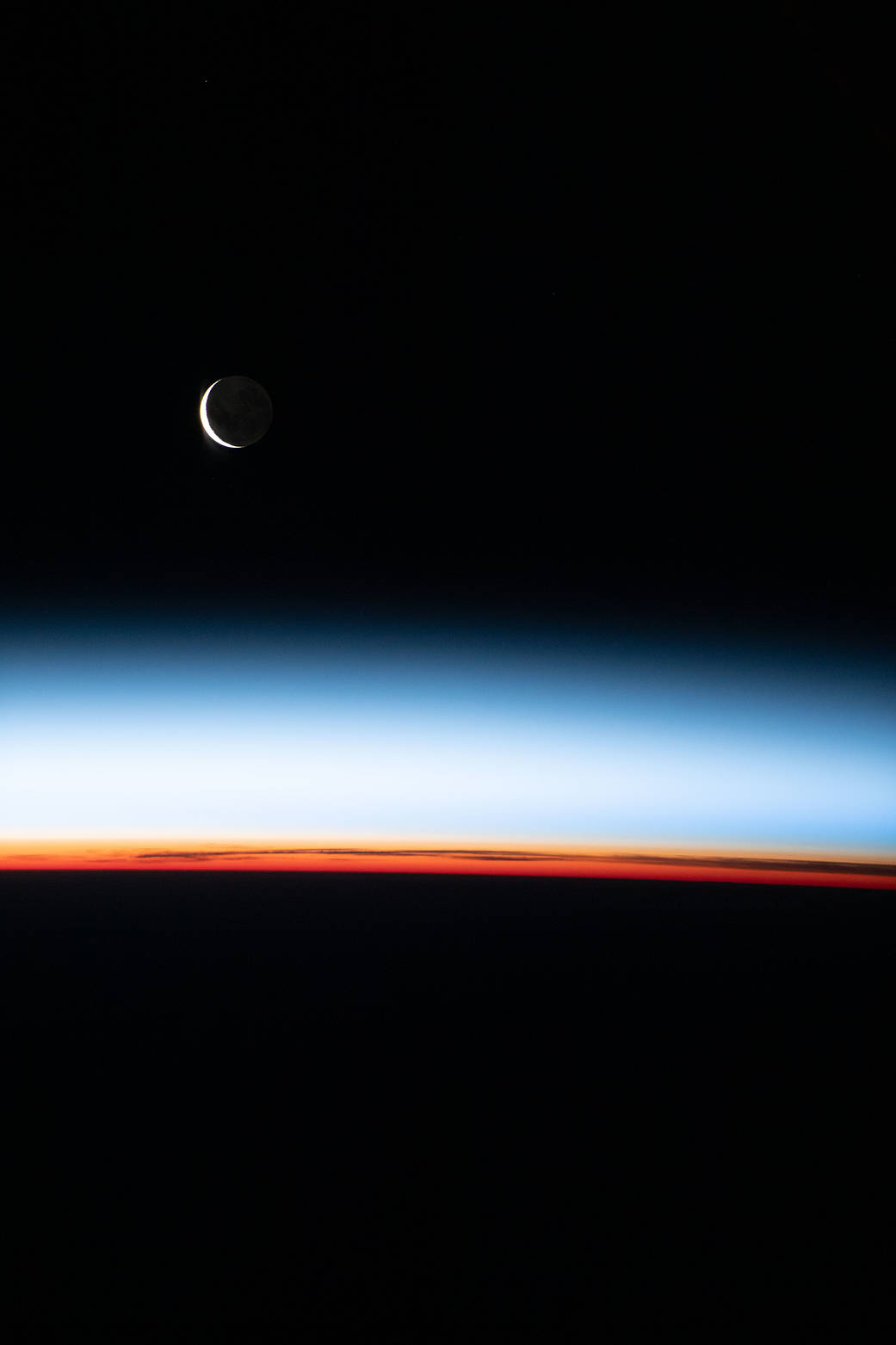 A waxing crescent Moon is pictured from the station