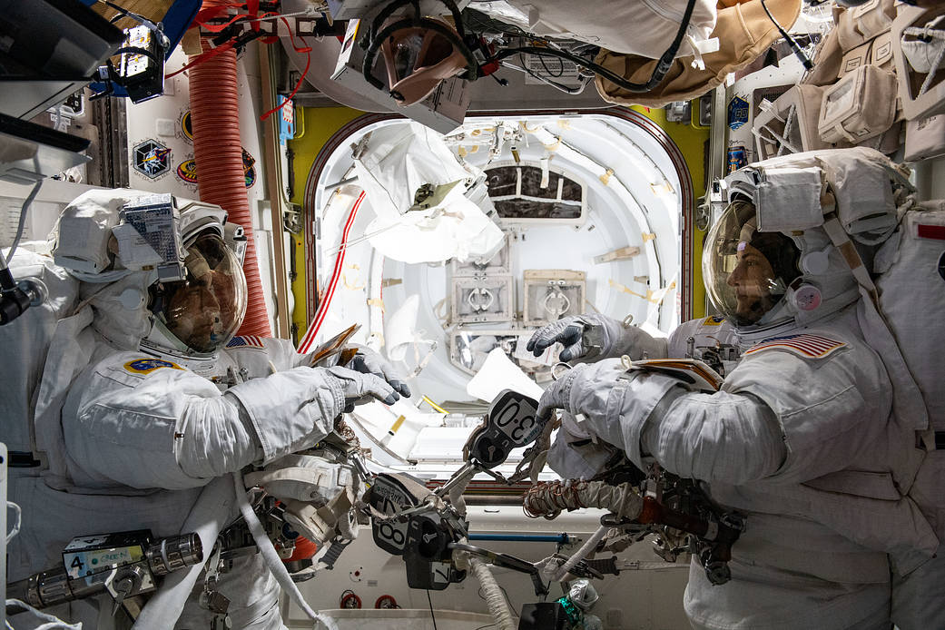Astronauts Raja Chari and Kayla Barron prepare for a spacewalk