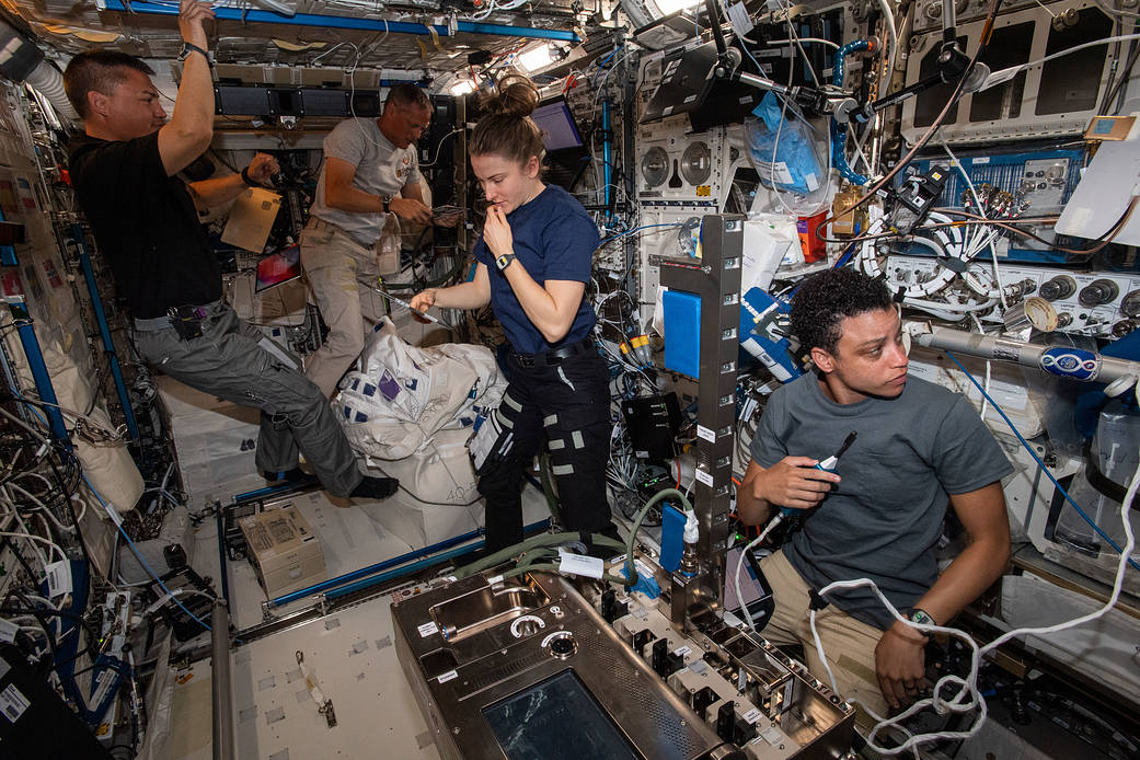 NASA astronauts work inside the Columbus laboratory module