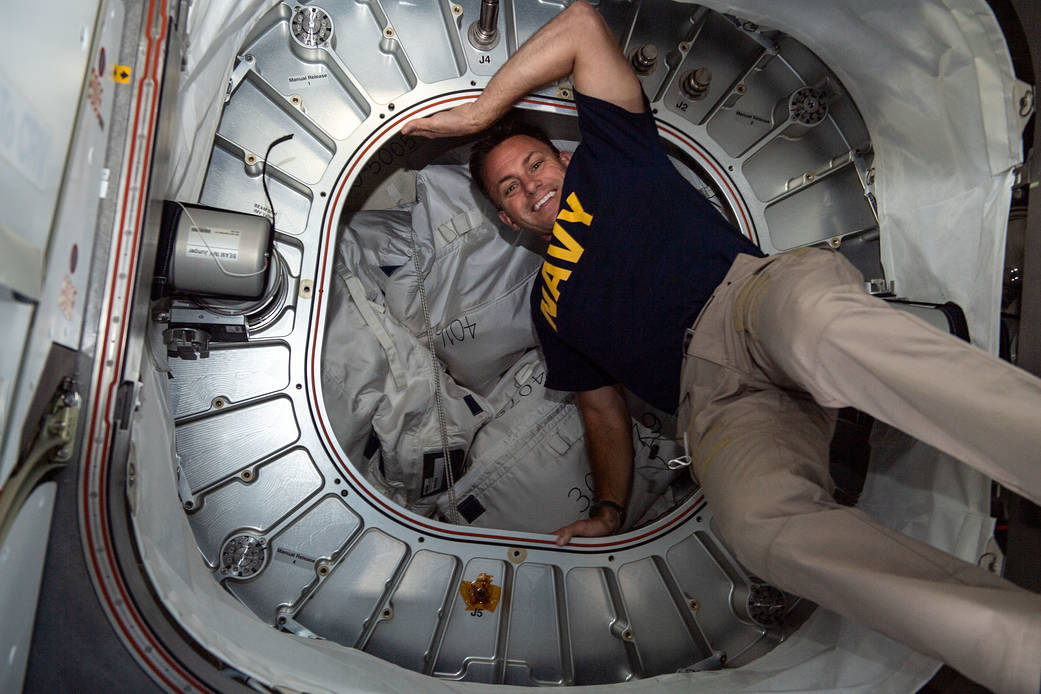 Astronaut Josh Cassada poses in front of BEAM