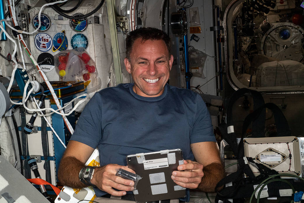 Astronaut Josh Cassada works inside the Columbus laboratory module