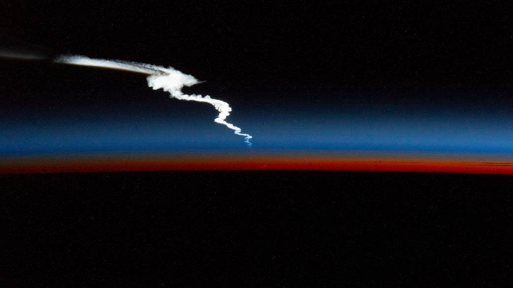 Launch plume of the SpaceX Falcon Heavy rocket seen from the station