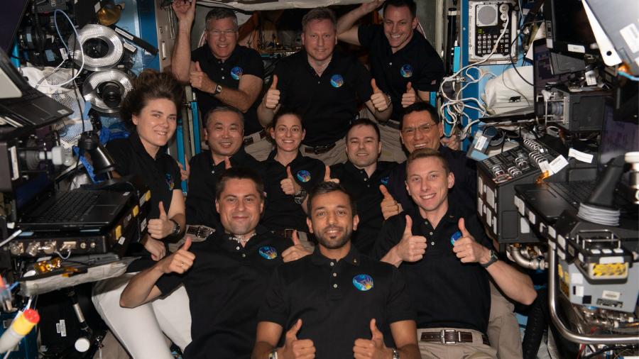 The 11-member crew aboard the International Space Station give thumbs up signs in this portrait from March 6, 2023. In the bottom row from left are Flight Engineers Andrey Fedyaev of Roscosmos, Sultan Alneyadi from UAE (United Arab Emirates), and Woody Hoburg from NASA. In the middle row from left are Flight Engineers Anna Kikina from Roscosmos, Koichi Wakata from JAXA (Japan Aerospace Exploration Agency), Nicole Mann from NASA, Dmitri Petelin from Roscosmos, and Frank Rubio from NASA. In the back are Flight Engineer Stephen Bowen from NASA, Commander Sergey Prokopyev from Roscosmos, and Flight Engineer Josh Cassada from NASA.