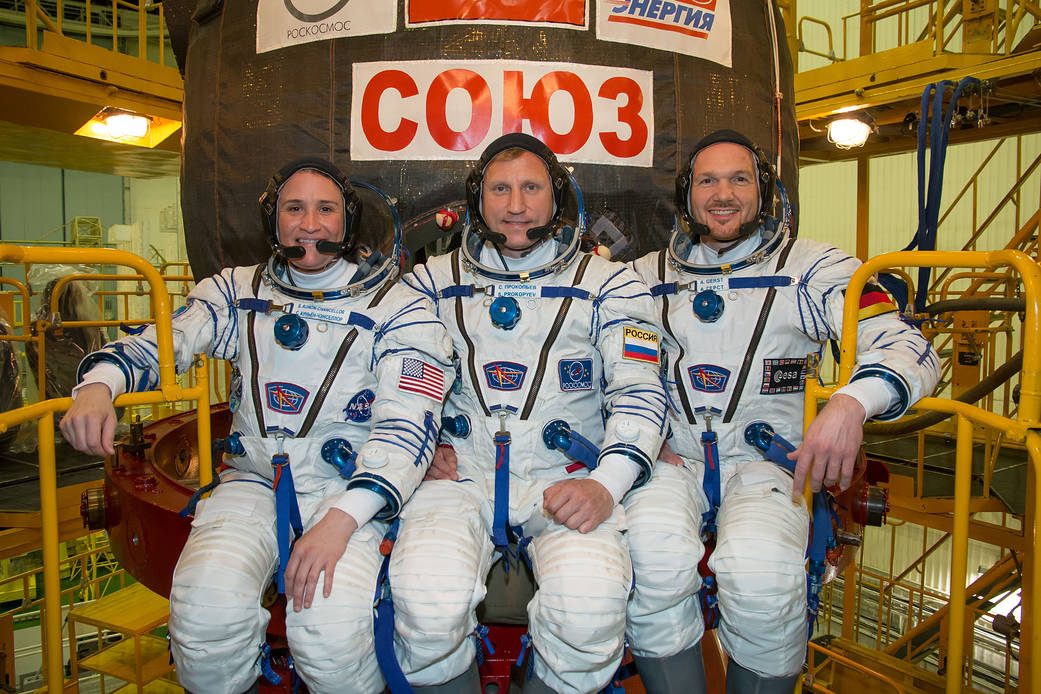 Expedition 56 crew members in their Russian Sokol launch and entry suits