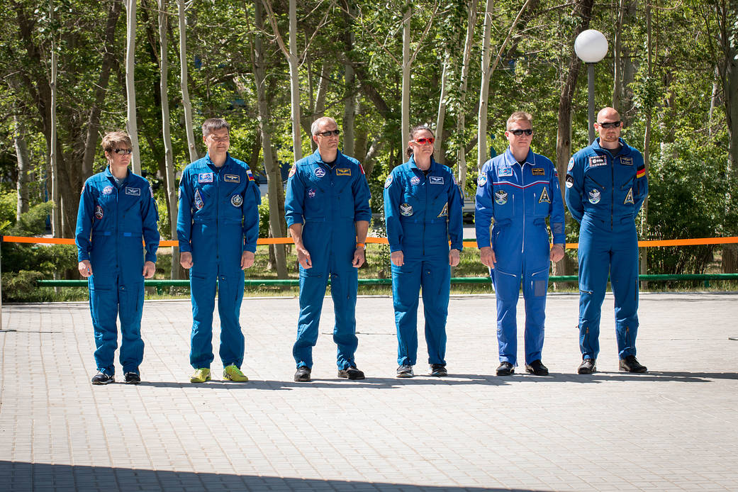 Expedition 56 prime and backup crew members attend traditional flag-raising ceremonies