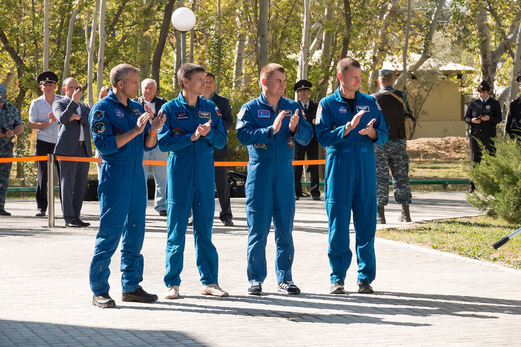 Expedition 57 prime and backup crews during flag raising ceremonies