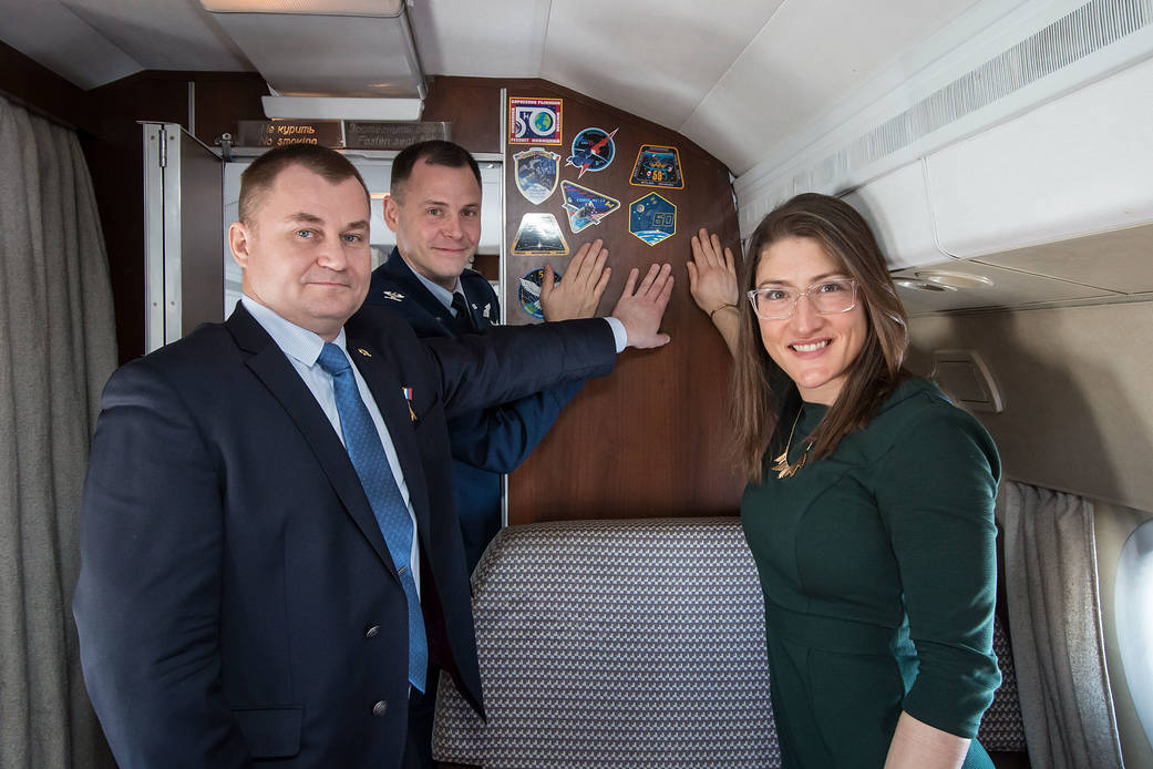 Expedition 59 crew members display crew insignia stickers