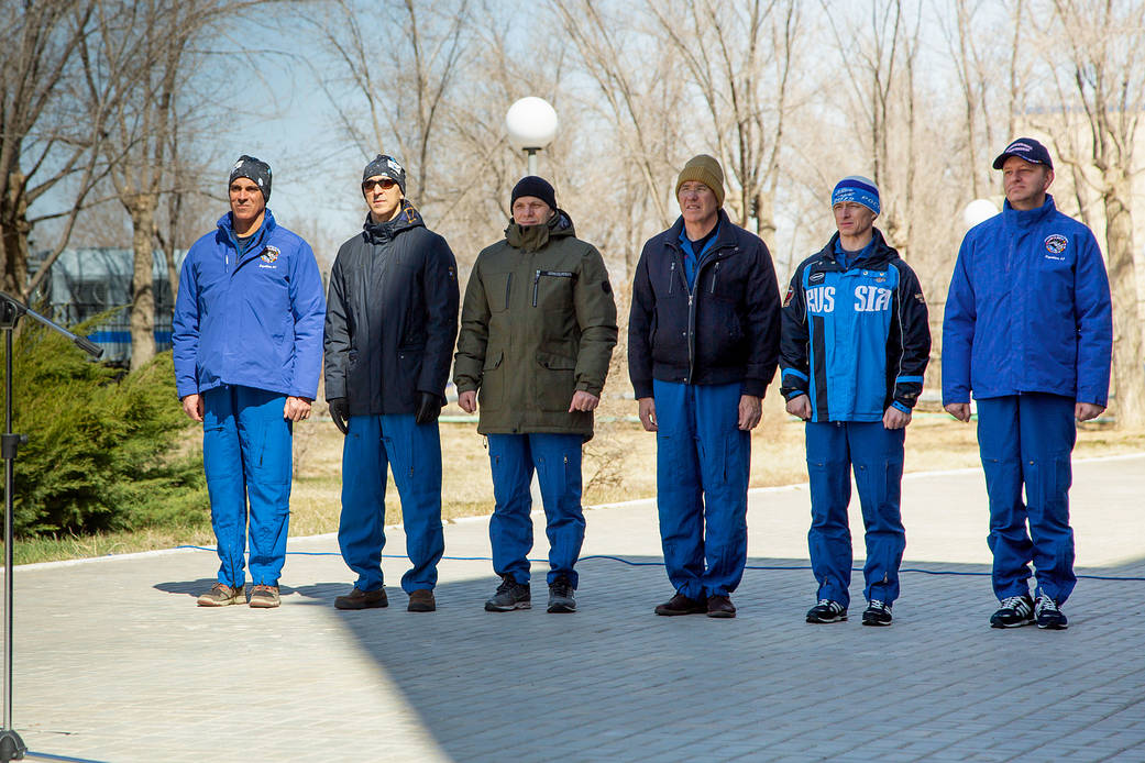 Expedition 63 prime and backup crews at traditional flag raising ceremony