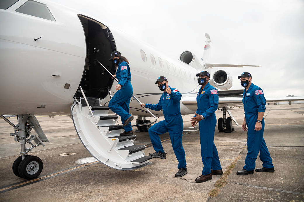 SpaceX Crew-1 crewmates board their jet at Ellington Field in Houston