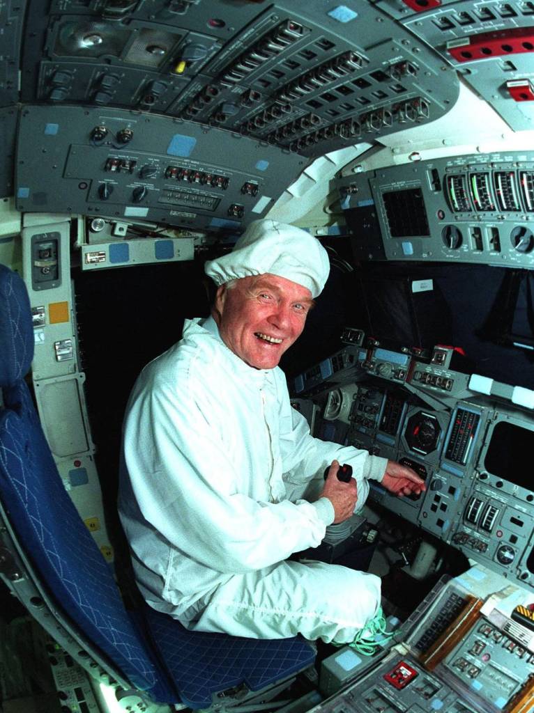 John Glenn inside flight deck of Columbia orbiter at NASA's Kennedy Space Center