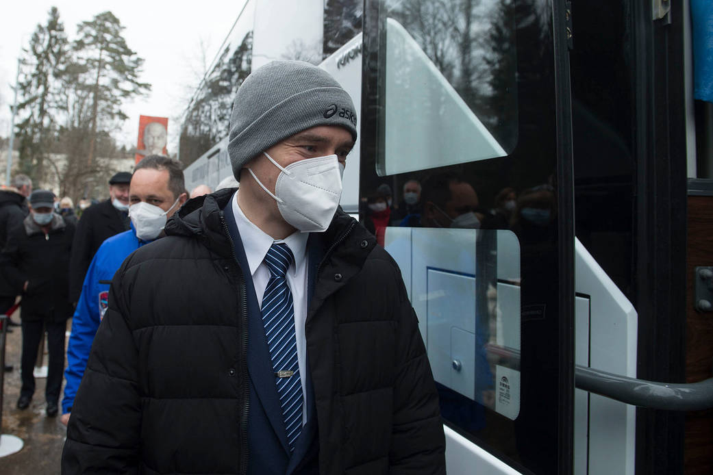 Cosmonaut Pyotr Dubrov of Roscosmos boards the bus