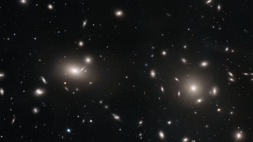 galaxies surrounded by tiny pinpoints of light