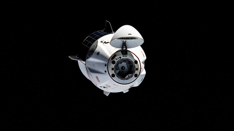 The SpaceX Crew Dragon Resilience is pictured during a relocation maneuver on April 5, 2021, carrying astronauts Michael Hopkins, Victor Glover, Shannon Walker and Soichi Noguchi.