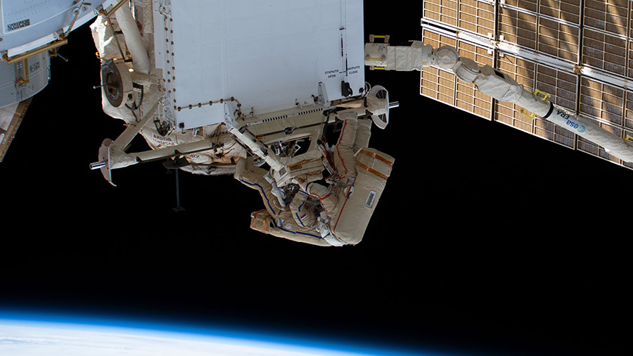 Cosmonauts Sergey Prokopyev and Dmitri Petelin work to remove a radiator from the space station's Rassvet module during a spacewalk on April 19, 2023.