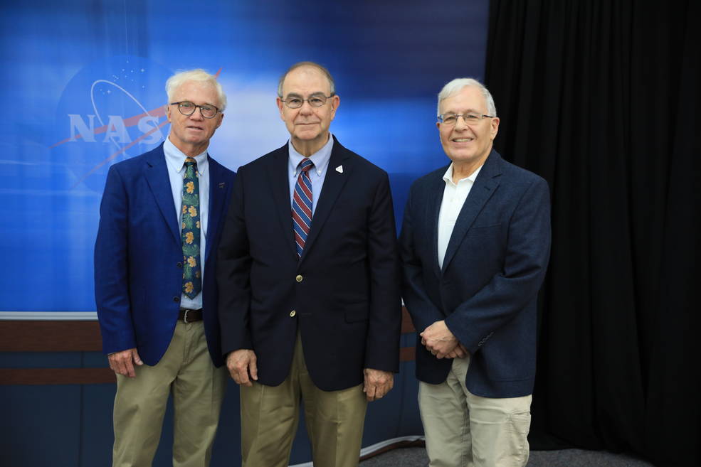 From left are Red Huber, Bob Granath, and Mark Kramer are the latest honorees to have their names added to the "Chroniclers" wall at Kennedy Space Center's News Center in Florida on May 1, 2023.