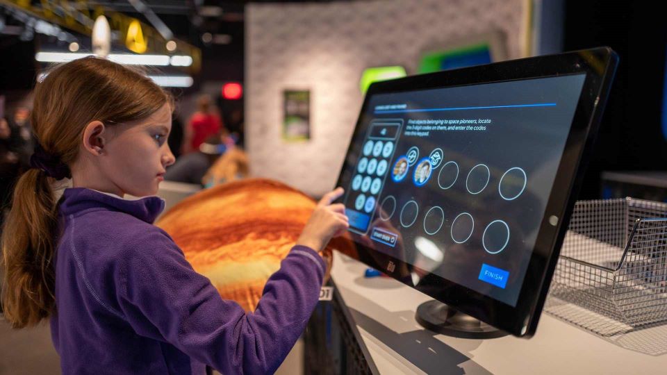 A student explores the Moonshot Museum