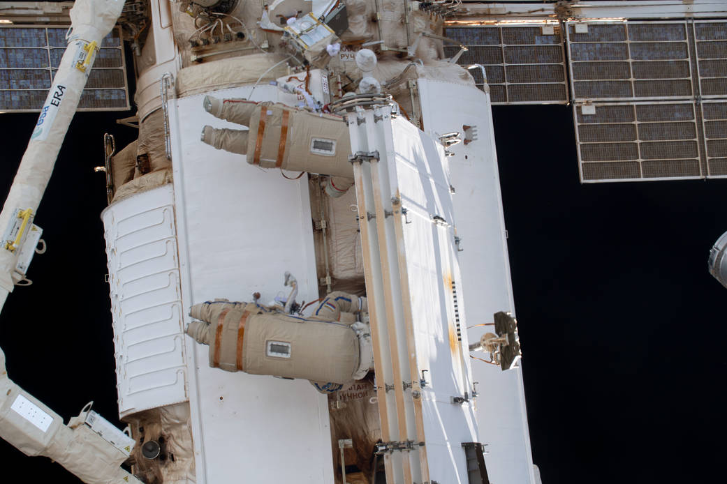 Roscosmos spacewalkers install a radiator on the Nauka module