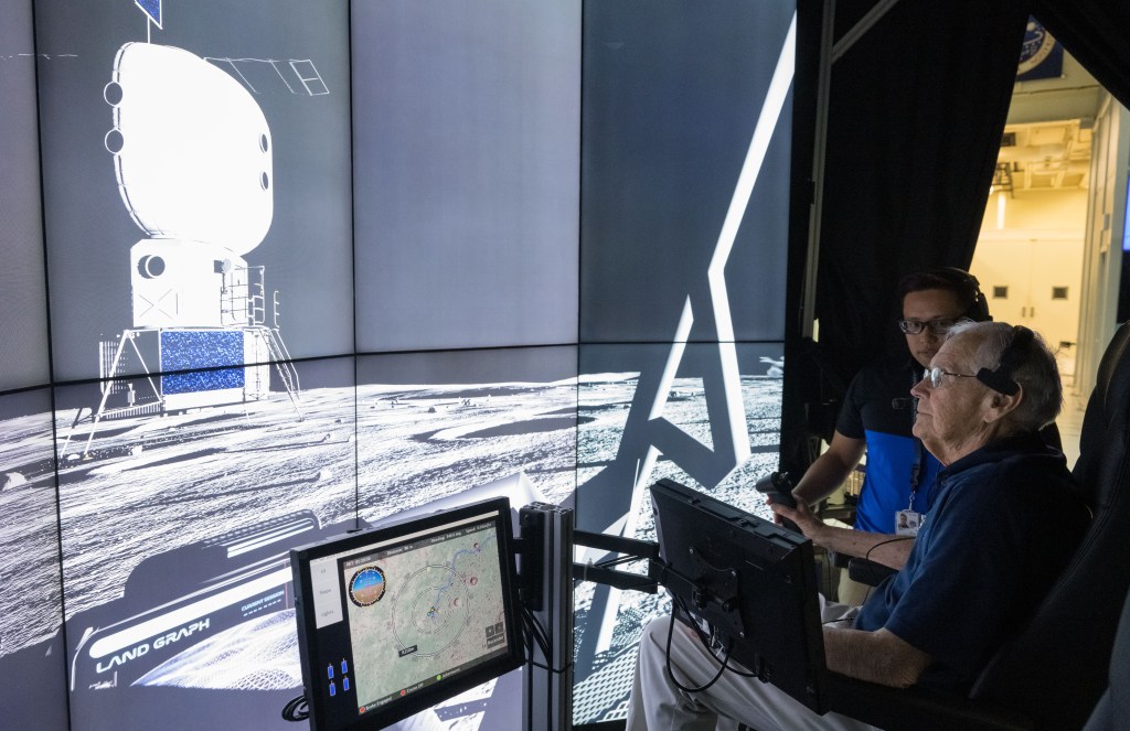 Astronaut Charlie Duke in a lunar rover simulation