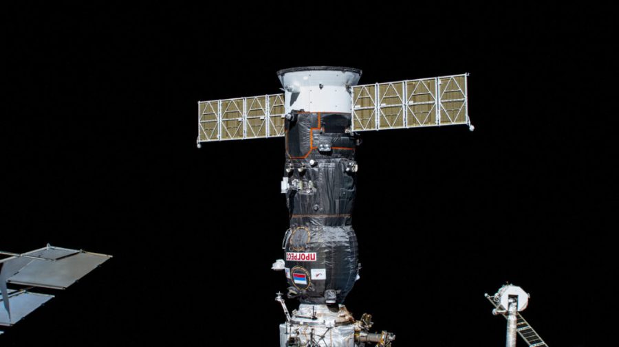 The ISS Progress 84 cargo craft from Roscosmos is pictured docked to the International Space Station's Poisk module.