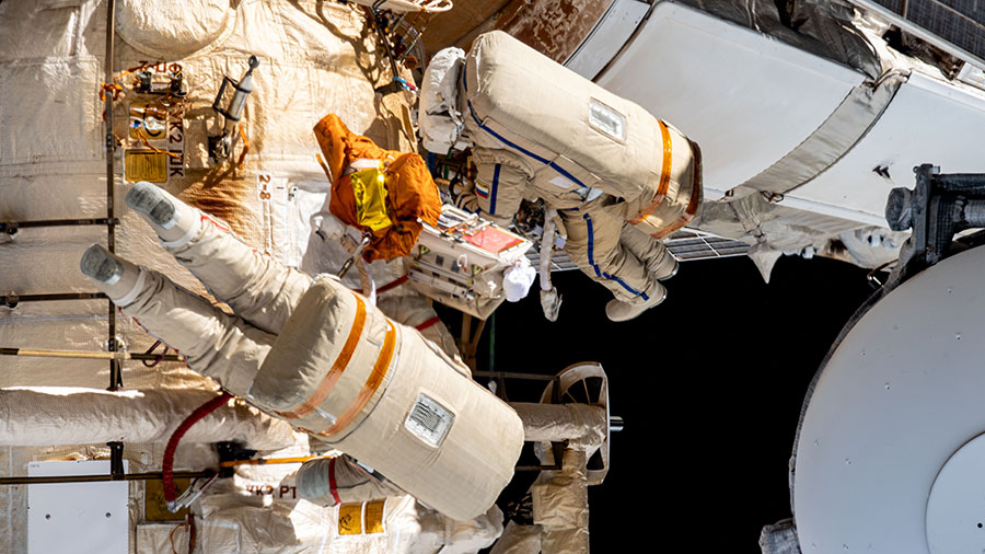 Spacewalkers Sergey Prokopyev and Dmitri Petelin are pictured working outside the space station during the installation of an experiment airlock on the Nauka science module on May 3.