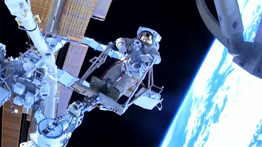 Cosmonaut Sergey Prokopyev rides the European robotic arm for the first time during a spacewalk in this view from fellow cosmonaut Dmitri Petelin's helmet cam. Credit: NASA TV