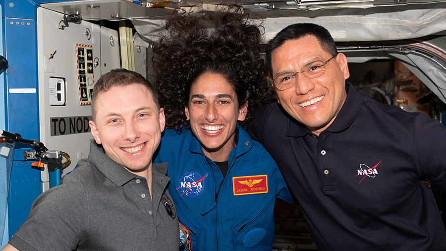 NASA astronauts Woody Hoburg, Jasmin Moghbeli, and Frank Rubio pose for a portrait aboard the International Space Station.