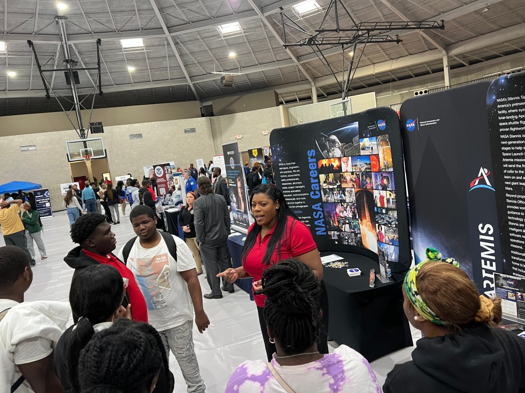 Employees from NASA Stennis and NASA Marshall engage with career fair attendees