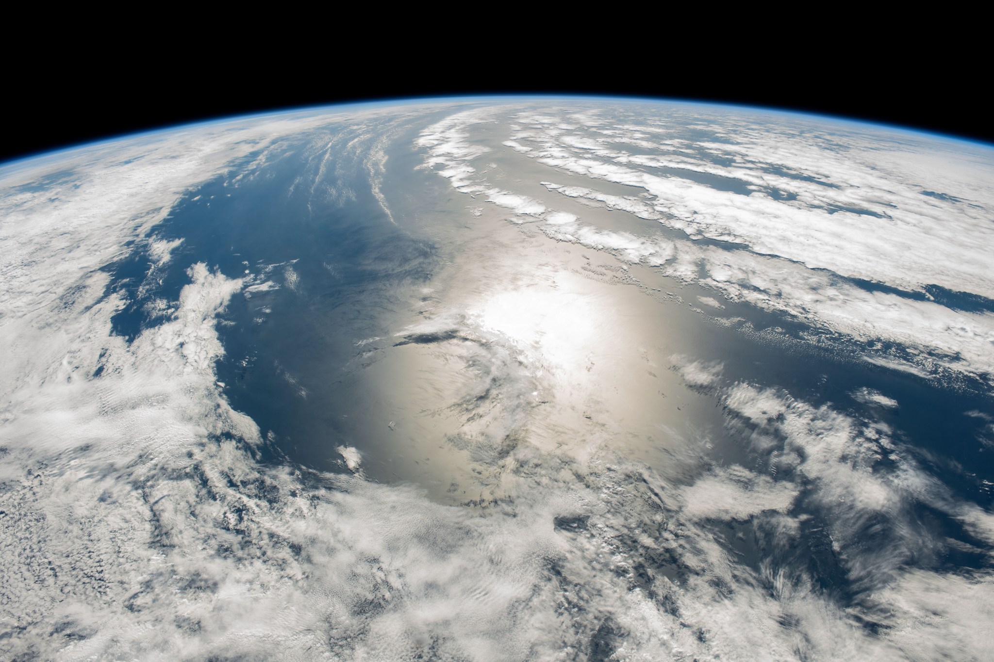 The sun's glint beams in between a cloudy stretch of the south Atlantic Ocean off the coast of Argentina.