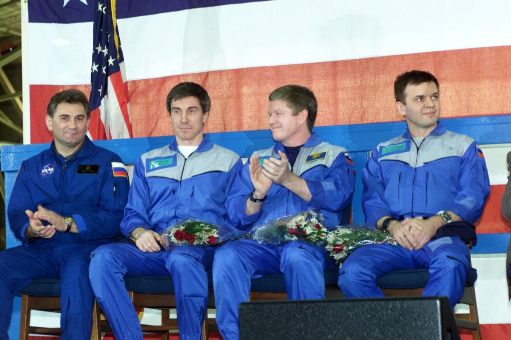 Some of the participants of the Expedition One and STS-102 crew return ceremony applaud one of the speakers. Pictured from the left are cosmonaut Vasily Tsibliev, Deputy Director of the Gagarin Cosmonaut Training Center in Star City; cosmonaut Sergei K. Krikalev, Expedition One flight engineer; astronaut William M. (Bill) Shepherd, mission commander; and Yuri P. Gidzenko, Soyuz commander.