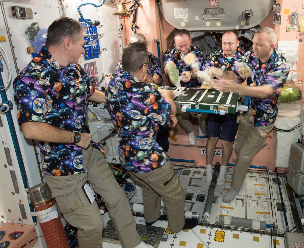 The Expedition 53 crew eating Thanksgiving dinner