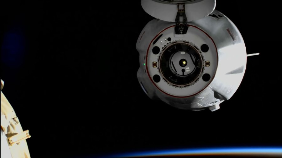 The SpaceX Dragon cargo craft backs away from the space station moments after undocking during an orbital sunrise on Aug. 19, 2022. Credit: NASA TV