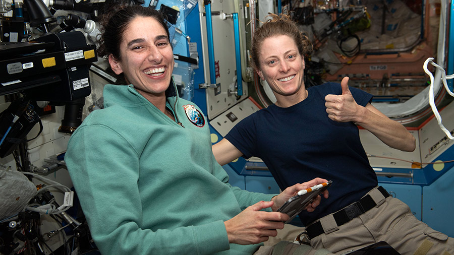 NASA astronauts (from left) Jasmin Moghbeli and Loral O'Hara pose for a portrait while working inside the Destiny laboratory module.