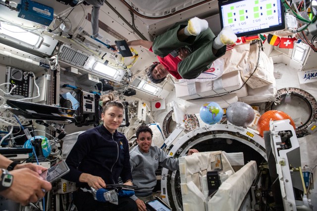 Expedition 67 Flight Engineers Kayla Barron and Jessica Watkins, both from NASA, and Samantha Cristoforetti from ESA (European Space Agency) are pictured checking out systems inside the International Space Station's Kibo laboratory module.