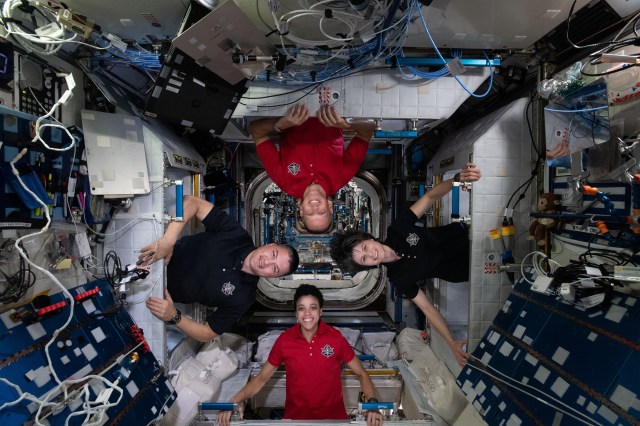 Expedition 67 Flight Engineers (clockwise from bottom) Jessica Watkins, Kjell Lindgren, and Bob Hines, all from NASA, and Samantha Cristoforetti of ESA (European Space Agency), pose for a fun portrait inside their individual crew quarters aboard the International Space Station.