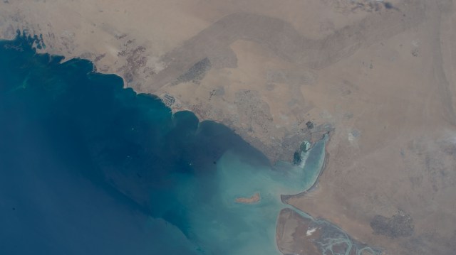 Kuwait City, on the south shore of Kuwait Bay on the Persian Gulf, is pictured from the International Space Station as it orbited 257 miles above western Iran.