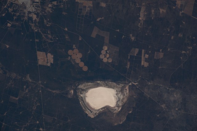Lake Salinas del Bebedero rests southwest of San Luis, Argentina (upper left), in this photograph from the International Space Station as it orbited 269 miles above. The area pictured lies at the foot of the Sierra Grande Mountains in the temperate grassland region of central Argentina.