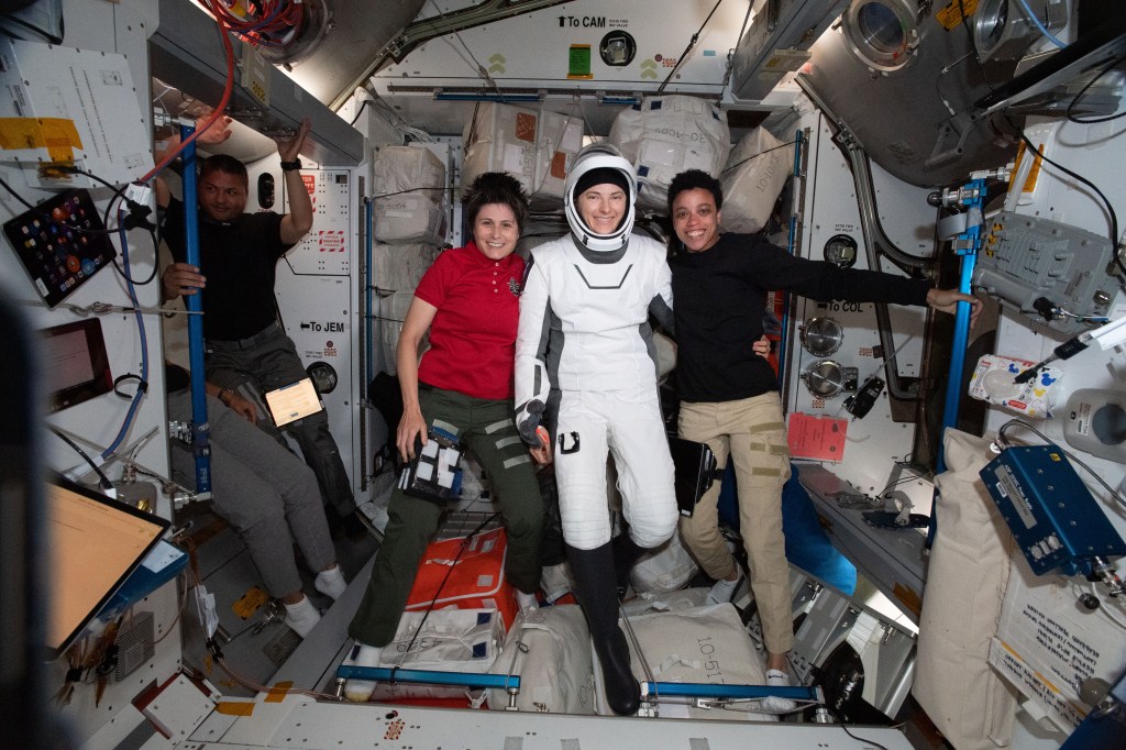 NASA astronaut Kayla Barron is pictured in her SpaceX flight suit before boarding the Dragon Endurance crew ship and departing for Earth. She is posing with (from left) NASA astronaut Kjell Lindgren, ESA (European Space Agency) astronaut Samantha Cristoforetti, and NASA astronaut Jessica Watkins.