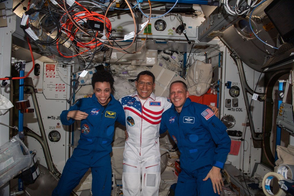 NASA astronaut Frank Rubio (center) is greeted by fellow NASA astronauts Jessica Watkins and Bob Hines shortly after he arrived at the International Space Station. Rubio docked to the orbiting lab's Rassvet module earlier with Roscosmos cosmonauts (out of frame) Sergey Prokopyev and Dmitri Petelin aboard the Soyuz MS-22 crew ship beginning a six-month space research mission.