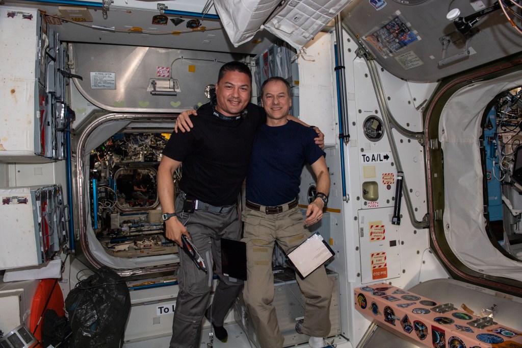 Expedition 67 Flight Engineers from NASA (from left) Kjell Lindgren and Tom Marshburn pose for a portrait inside the International Space Station's Unity module.