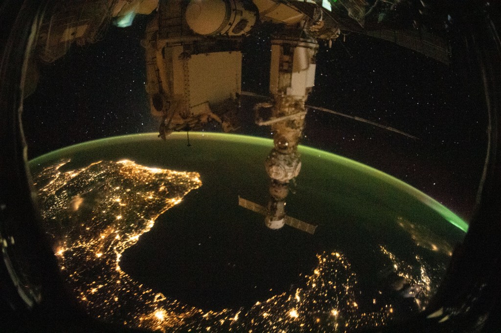 This night time photograph of the coastal city lights of Portugal, Spain, and France, with the Bay of Biscay in between, was taken from the International Space Station as it orbited 263 miles above the French city of Limoges. In the foreground, is the Soyuz MS-21 crew ship docked to the Prichal docking module which is itself attached to the Nauka multipurpose laboratory module.