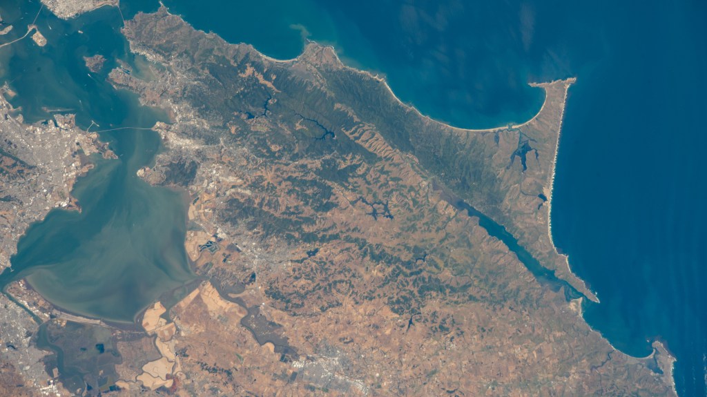 Portions of the cities of Oakland and San Francisco (upper left) on San Francisco Bay and San Pablo Bay in California are pictured from the International Space Station as it orbited 263 miles above Monterey Bay in the Golden State.