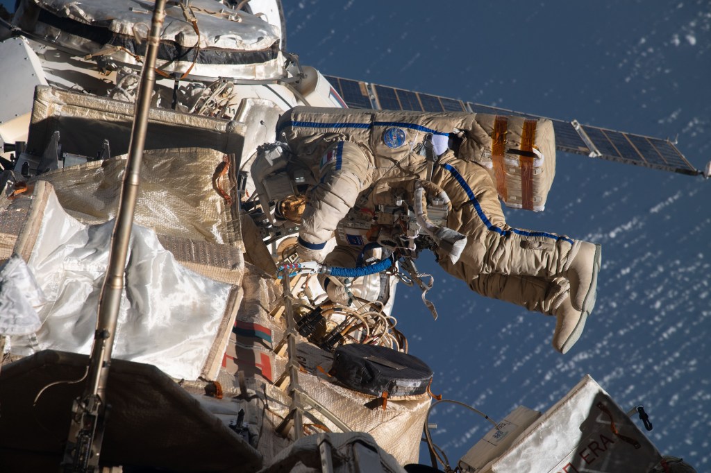 Spacewalker Samantha Cristoforetti of ESA (European Space Agency) works outside the Nauka multipurpose laboratory module on the International Space Station while wearing a Russian Orlan spacesuit. She continued the outfitting of the European robotic arm attached to Nauka during the spacewalk that lasted seven hours and five minutes.