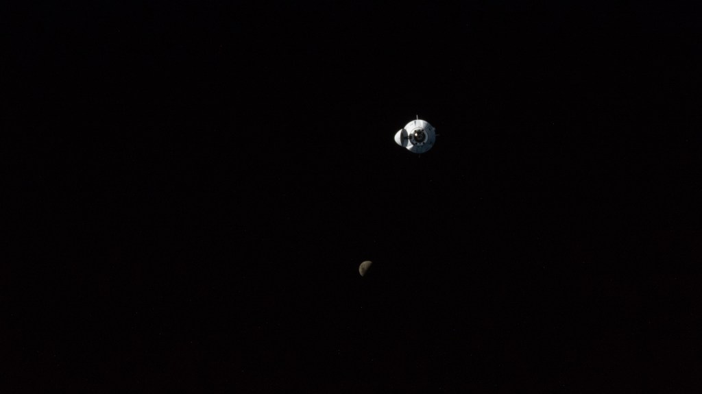 The SpaceX Dragon Endeavour crew ship carrying four Axiom Mission 1 astronauts approaches the International Space Station less than a day after launching from NASA's Kennedy Space Center in Florida. Pictured below Endeavour is the first quarter Moon as both spaceraft were orbiting 262 miles above central China.