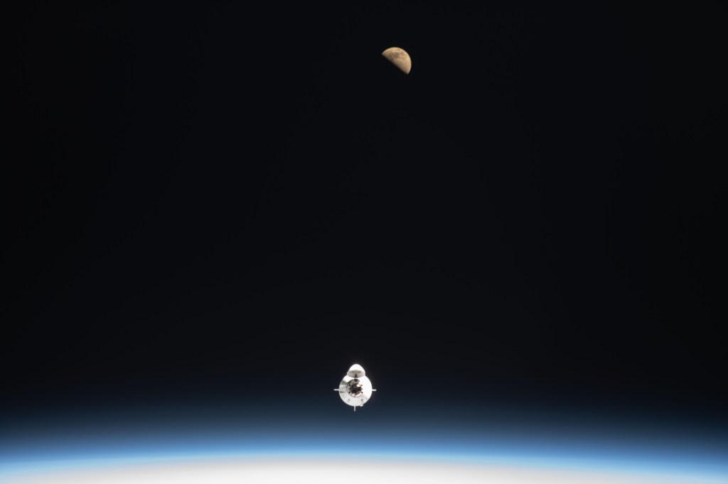 The SpaceX Dragon Endeavour crew ship carrying four Axiom Mission 1 astronauts approaches the International Space Station less than a day after launching from NASA's Kennedy Space Center in Florida. Pictured above Endeavour is the first quarter Moon as both spaceraft were orbiting 259 miles above the Atlantic Ocean off the coast of Morocco.