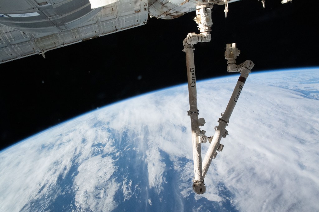 The 57.7-foot-long Canadarm2 robotic arm is attached to the International Space Station's Harmony module extending into a folded position 271 miles above the Indian Ocean south of Australia's island state of Tasmania.