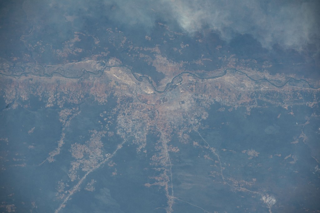 The Cubango River separates the African nations of Angola and Namibia in this photograph from the International Space Station as it orbited 260 miles above. The Namibian cities along the Cubango include Kasote, Sauyemwa, and Rundu.