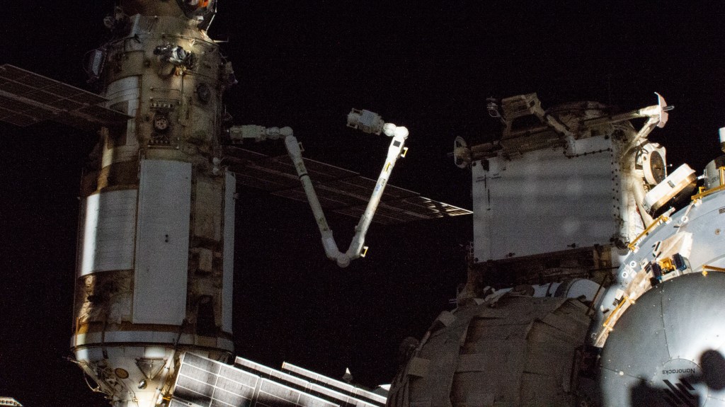 The European robotic arm, the International Space Station's third and newest robotic arm, is pictured attached to the Nauka multipurpose laboratory module on the orbitng lab's Russian segment.