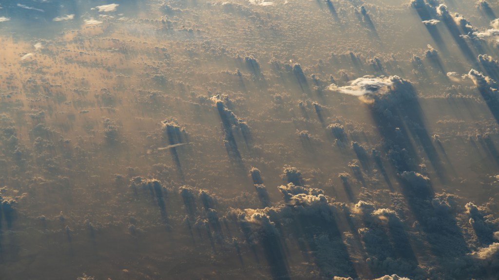 -iss068e040120 (Jan. 13, 2023) --- A sunset stretches cloud shadows over Tanzania in this photograph from the International Space Station as it orbited 259 miles above the African nation.