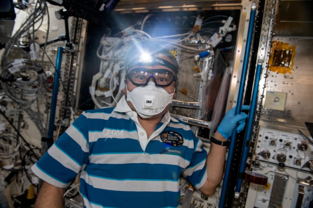 iss068e042026 (Jan. 26, 2023) --- Expedition 68 Flight Engineer Koichi Wakata of the Japan Aerospace Exploration Agency (JAXA) works on orbital plumbing tasks inside the International Space Station's Kibo laboratory module.
