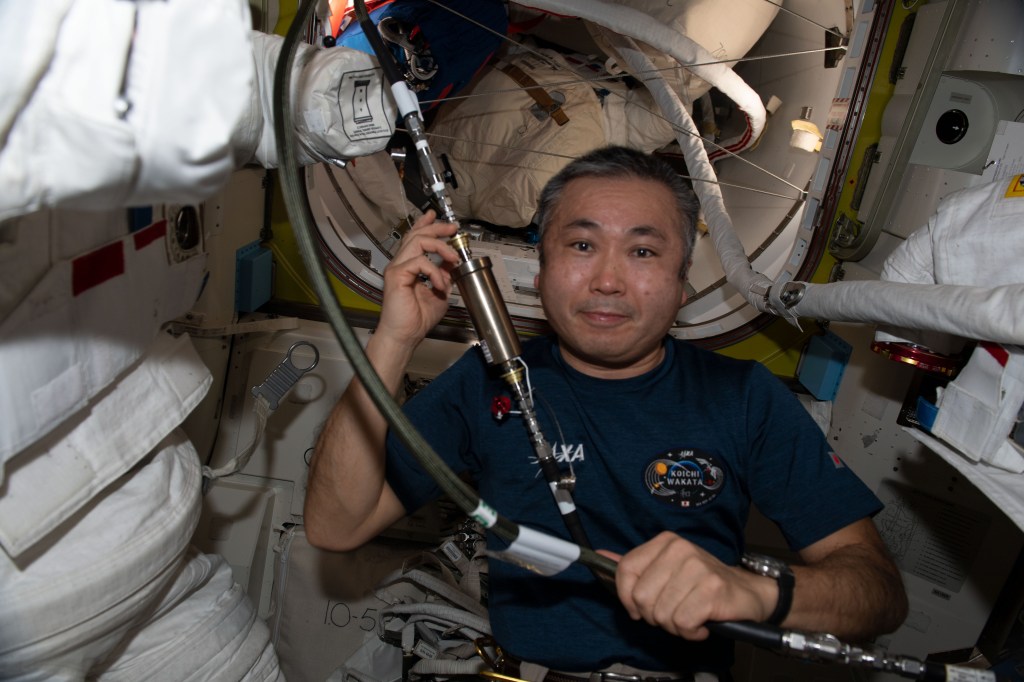 iss068e035487 (Dec. 29, 2022) --- Expedition 68 Flight Engineer Koichi Wakata of the Japan Aerospace Exploration (JAXA) works on cooling loops that are part of the Extravehicular Mobility Units, or spacesuits, that astronauts wear when working in the vacuum of space outside the International Space Station.